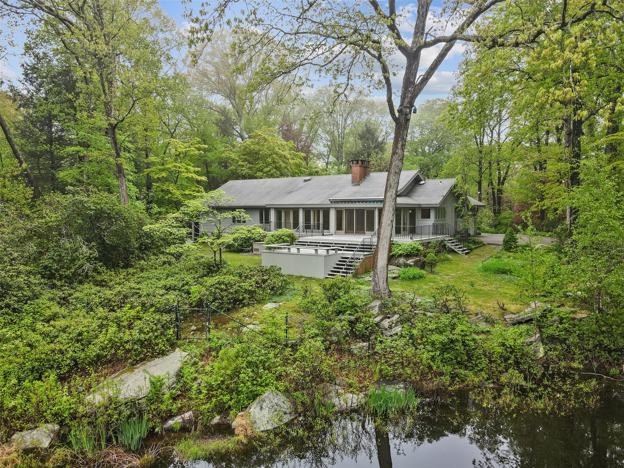 8 Hemlock Hill Road Pound Ridge, NY 10576 - Photo 1 of 1 a view of a house with a yard