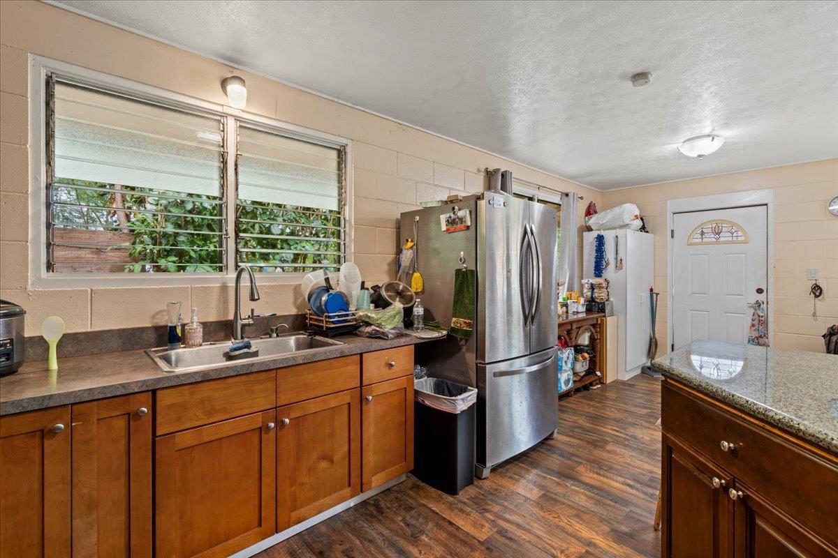 110 Aoloa Loop Kahului, HI 96732 - Photo 13 of 46 a kitchen with stainless steel appliances sink refrigerator and window