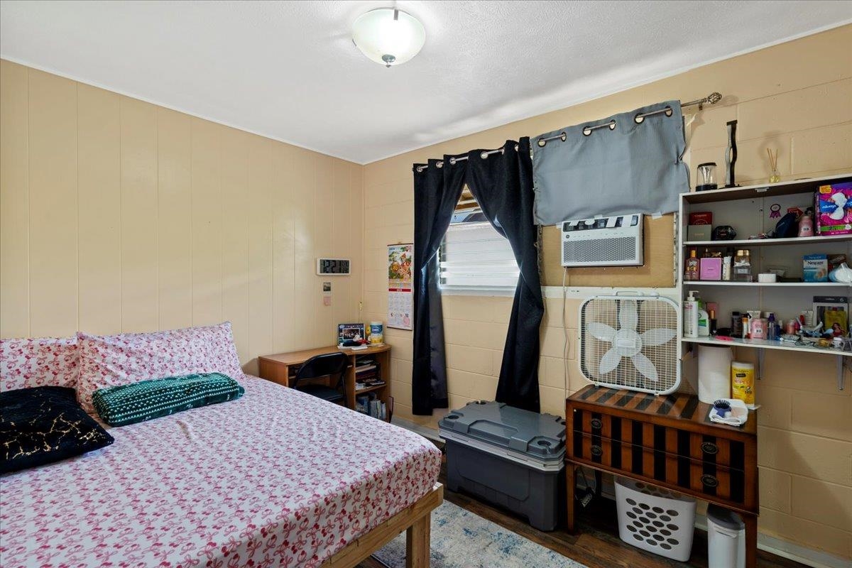110 Aoloa Loop Kahului, HI 96732 - Photo 23 of 46 a bedroom with a bed a dresser and book shelf
