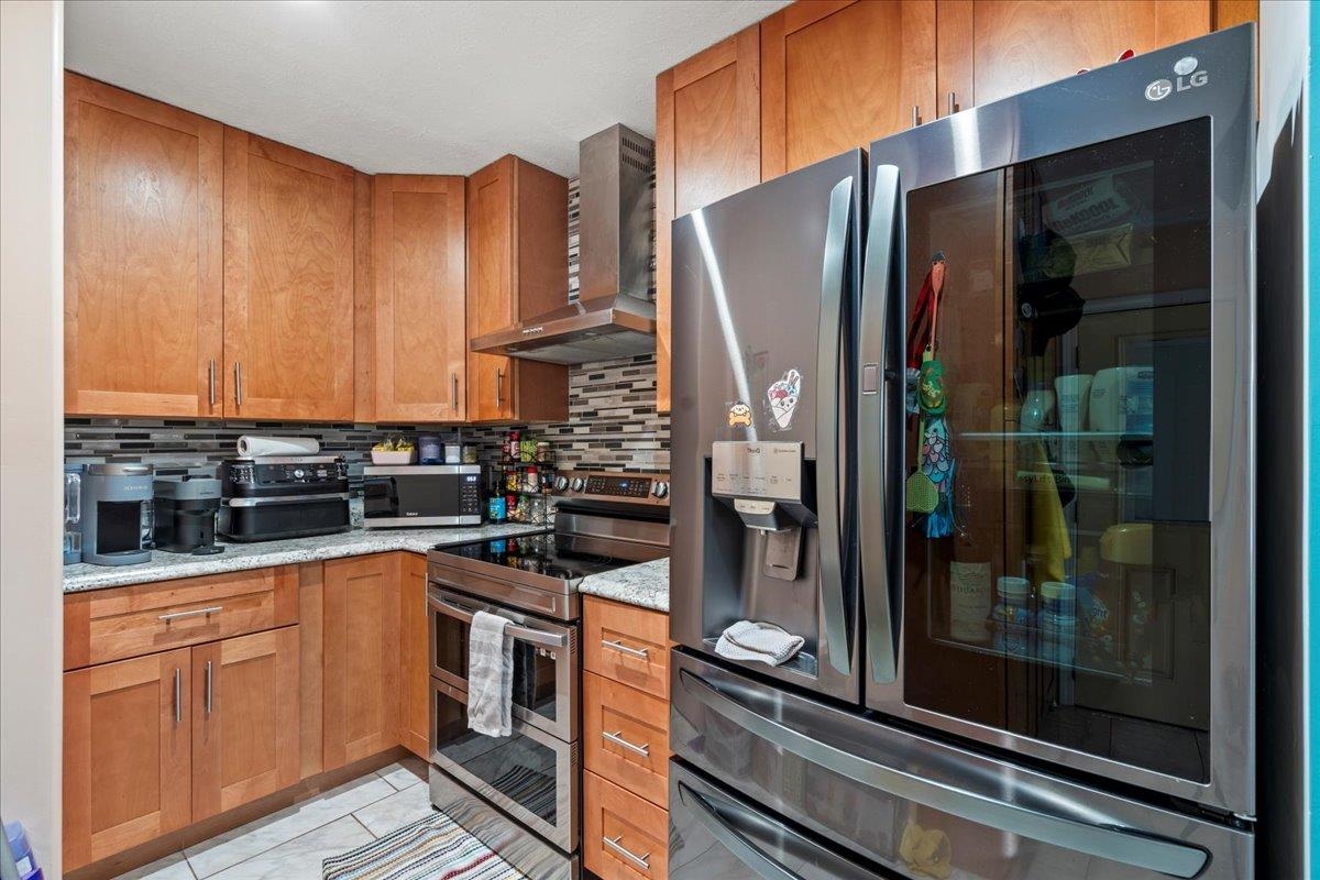 110 Aoloa Loop Kahului, HI 96732 - Photo 27 of 46 a kitchen with stainless steel appliances granite countertop a refrigerator and a sink