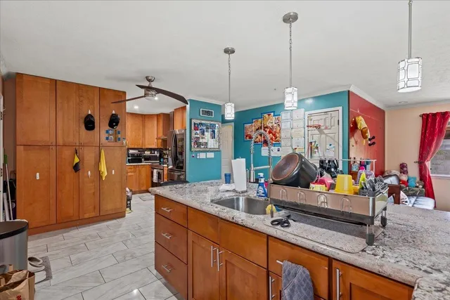 a living room with furniture a dining table and chairs