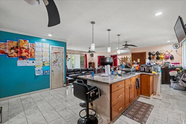 a kitchen with a sink a counter and appliances