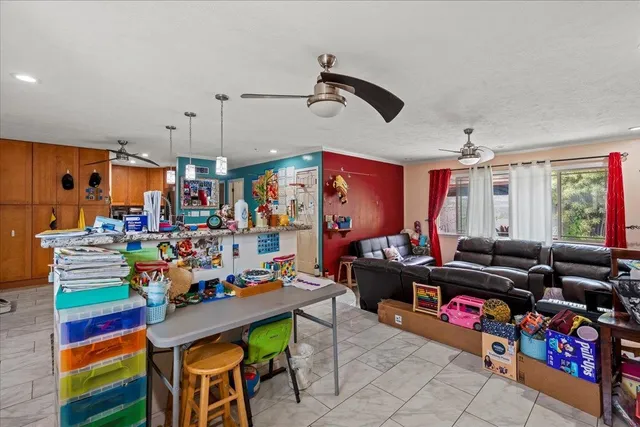 a room with lots of stuff and kitchen appliances