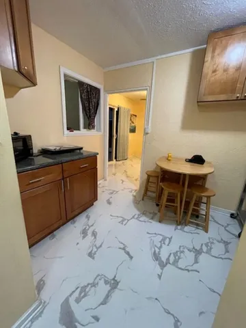 a spacious bathroom with a sink and a mirror