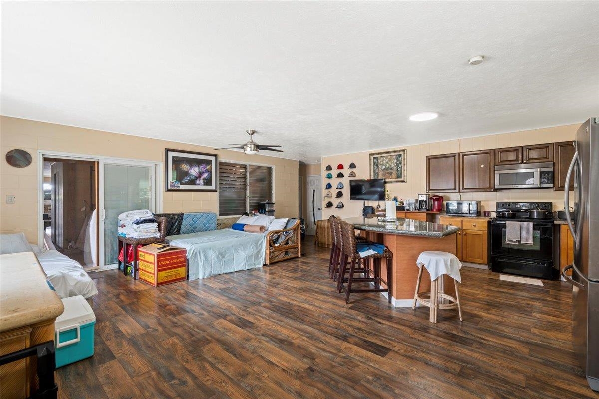 110 Aoloa Loop Kahului, HI 96732 - Photo 7 of 46 a living room with furniture and a kitchen view