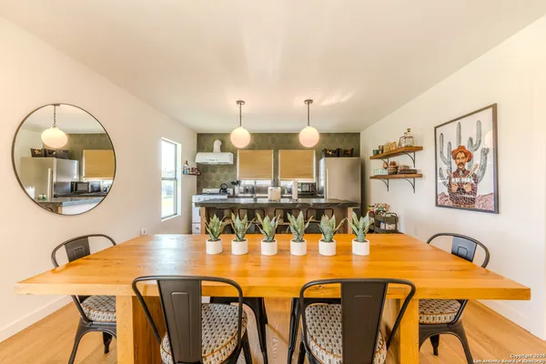 a view of a dining room with furniture and a table
