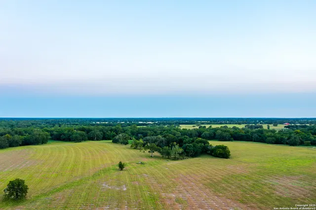 a view of a swimming pool and an outdoor seating