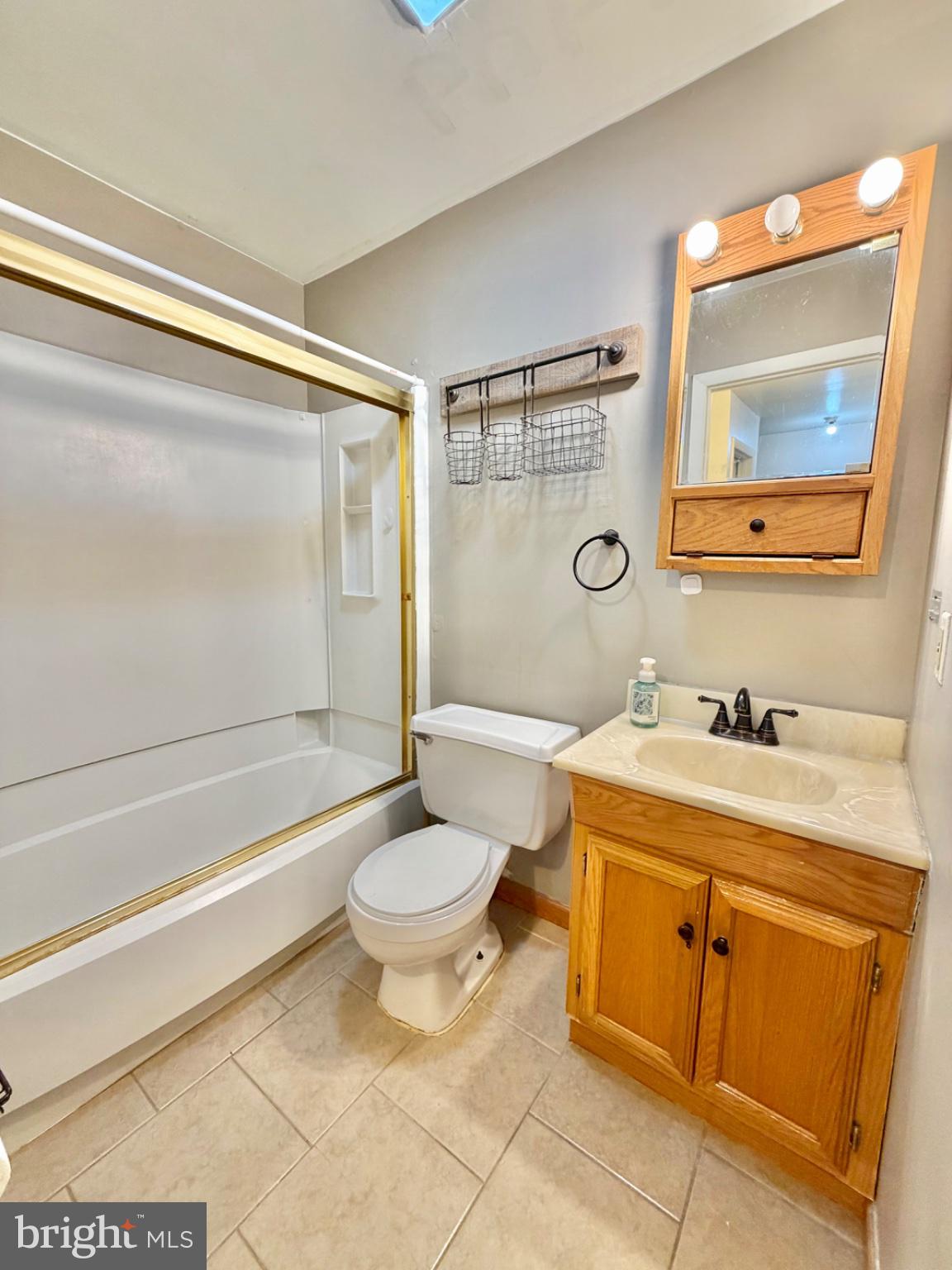 418 Green Street Lancaster, PA 17602 - Photo 18 of 26 a bathroom with a granite countertop sink toilet mirror and bathtub