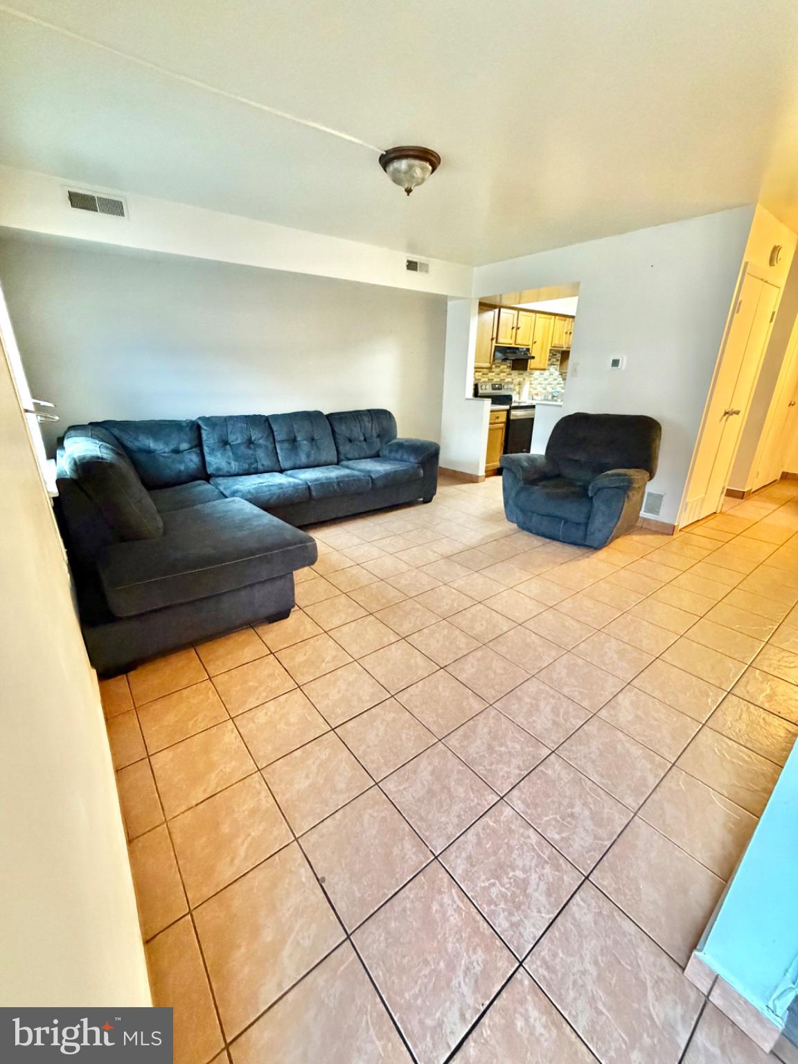 418 Green Street Lancaster, PA 17602 - Photo 4 of 26 a living room with a couch and dresser