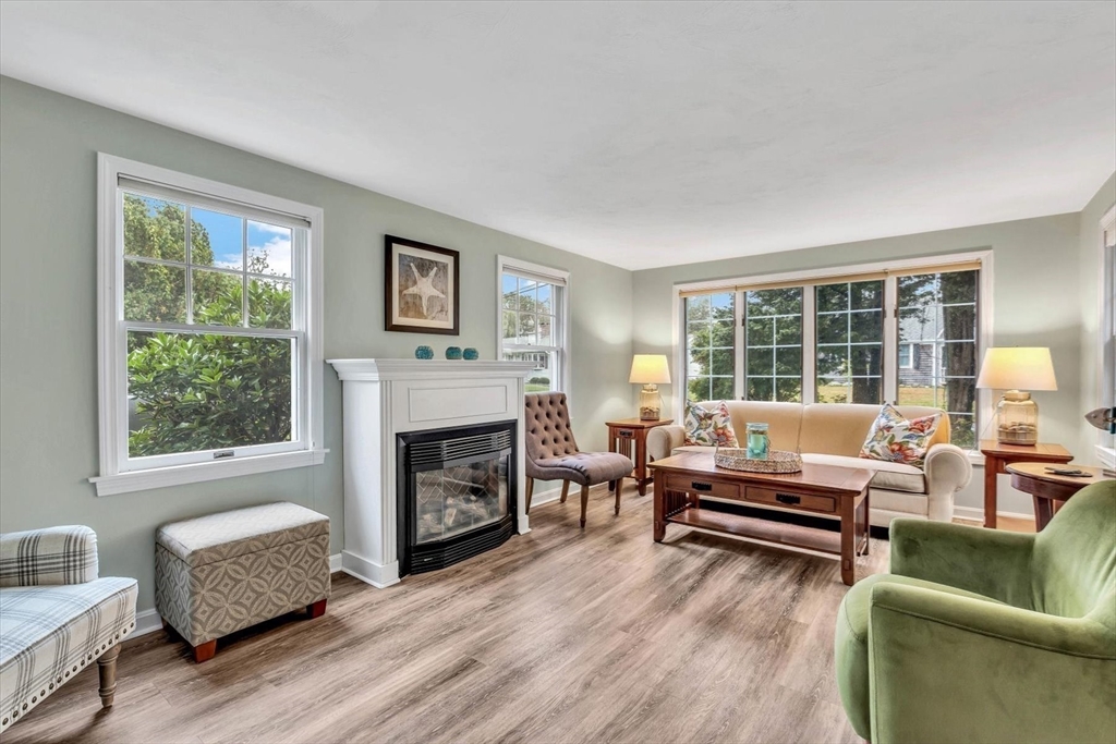30 Cove Road Eastham, MA 02642 - Photo 11 of 42 a living room with furniture and a fireplace