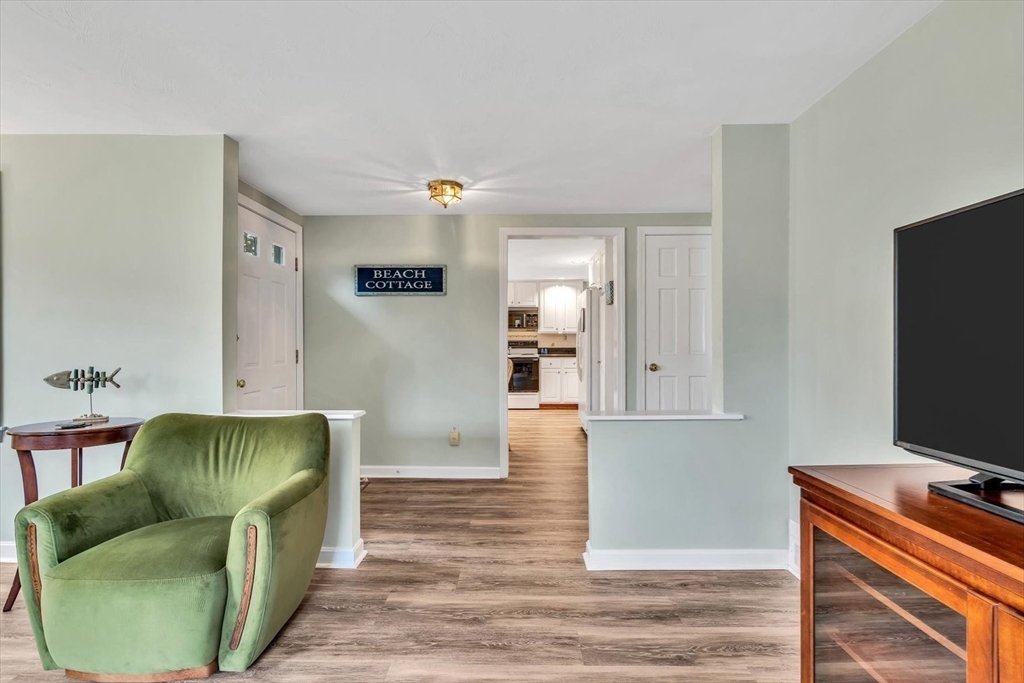 30 Cove Road Eastham, MA 02642 - Photo 12 of 42 a living room with furniture and a flat screen tv