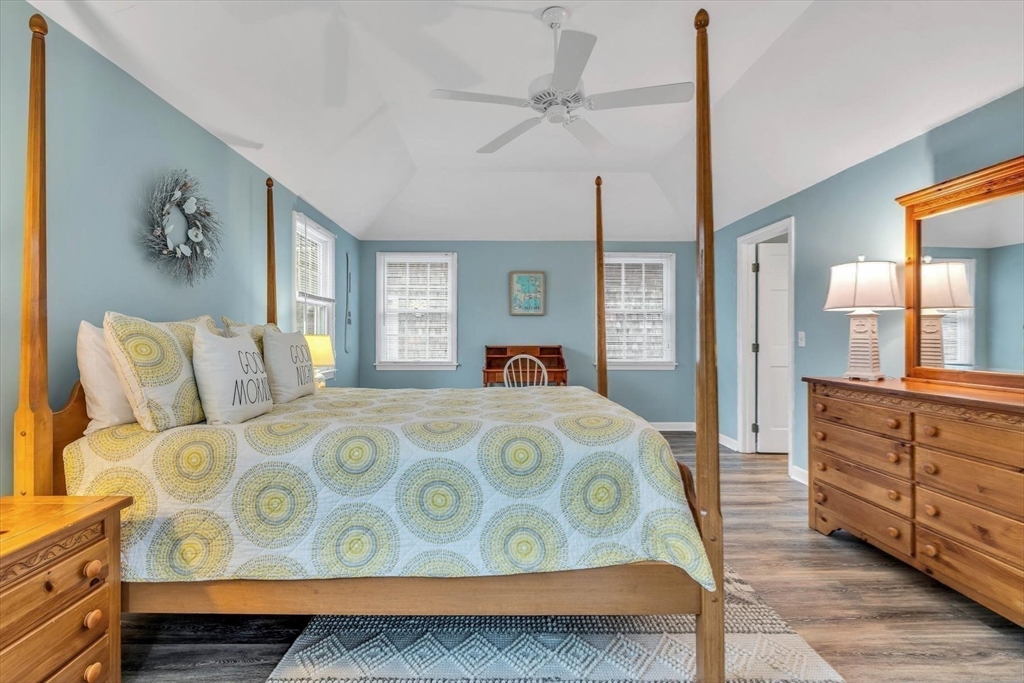 30 Cove Road Eastham, MA 02642 - Photo 26 of 42 a bedroom with a bed and wooden floor