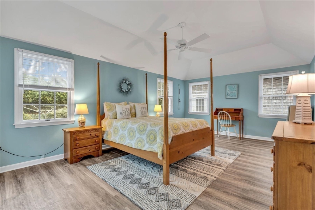 30 Cove Road Eastham, MA 02642 - Photo 27 of 42 a bedroom with a bed and wooden floor