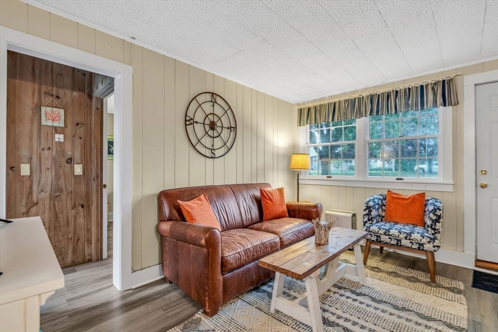 30 Cove Road Eastham, MA 02642 - Photo 35 of 42 a living room with furniture and a large window