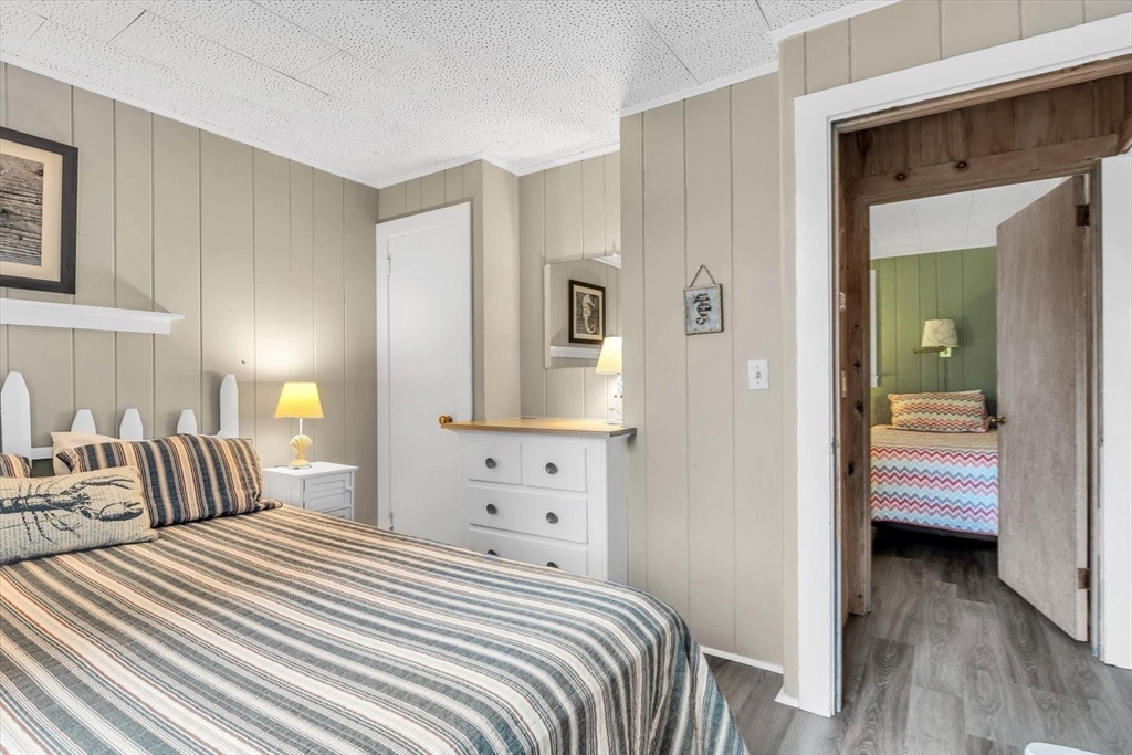 30 Cove Road Eastham, MA 02642 - Photo 36 of 42 a bedroom with a bed and a view of bedroom