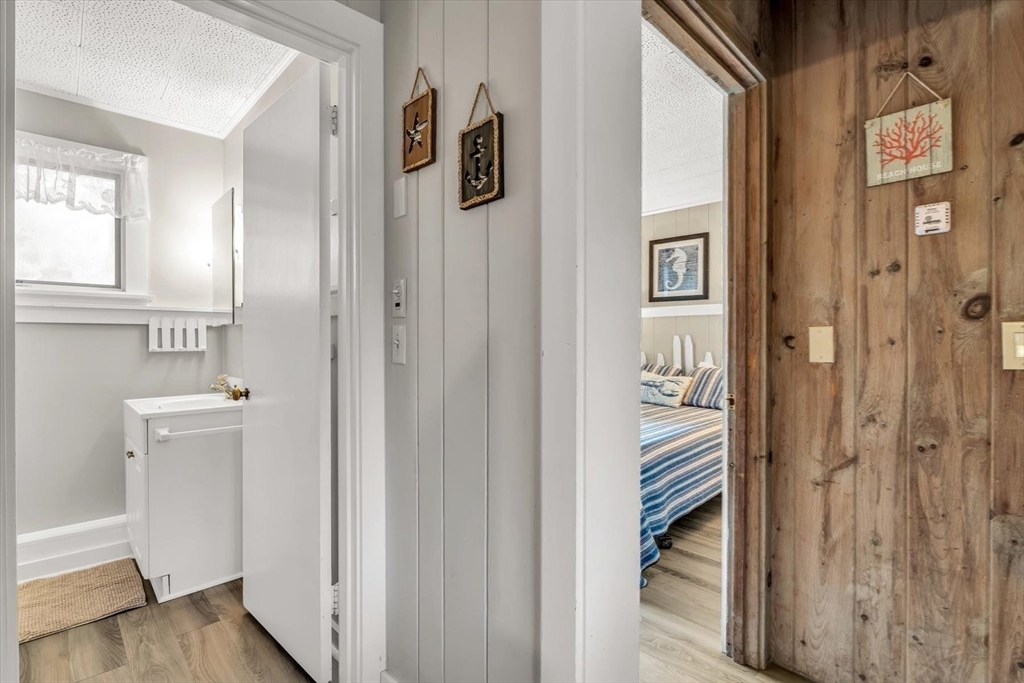30 Cove Road Eastham, MA 02642 - Photo 38 of 42 a view of a hallway with wooden floor and entryway
