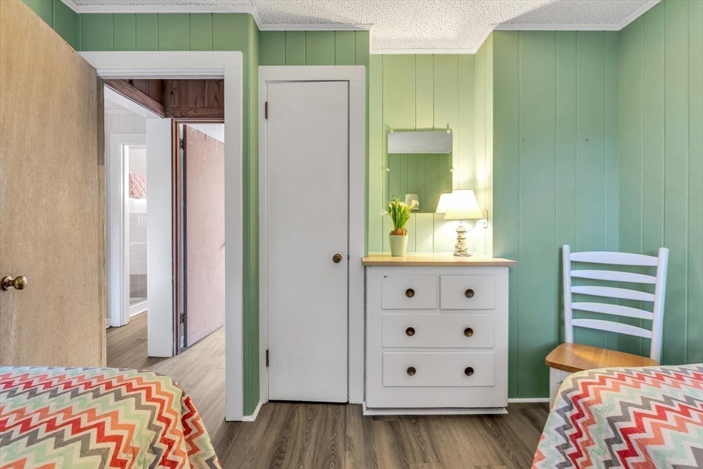 30 Cove Road Eastham, MA 02642 - Photo 40 of 42 a bedroom with a bed and furniture