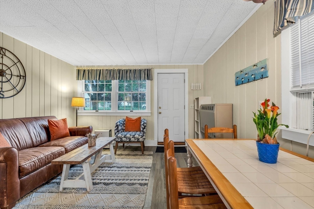 30 Cove Road Eastham, MA 02642 - Photo 41 of 42 a living room with furniture flowerpot and a potted plant