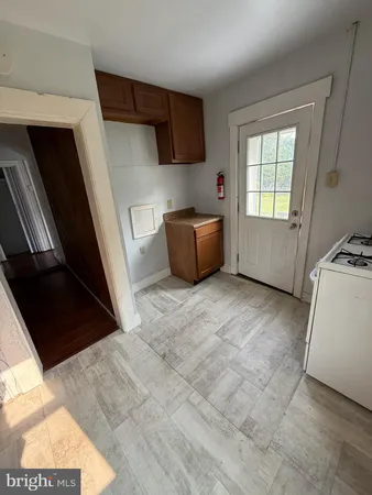 a view of kitchen with furniture and window