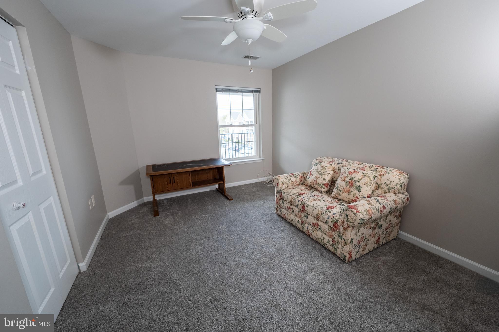 6506 Ridenour Way East, Unit 3A Eldersburg, MD 21784 - Photo 11 of 24 a living room with furniture and a window
