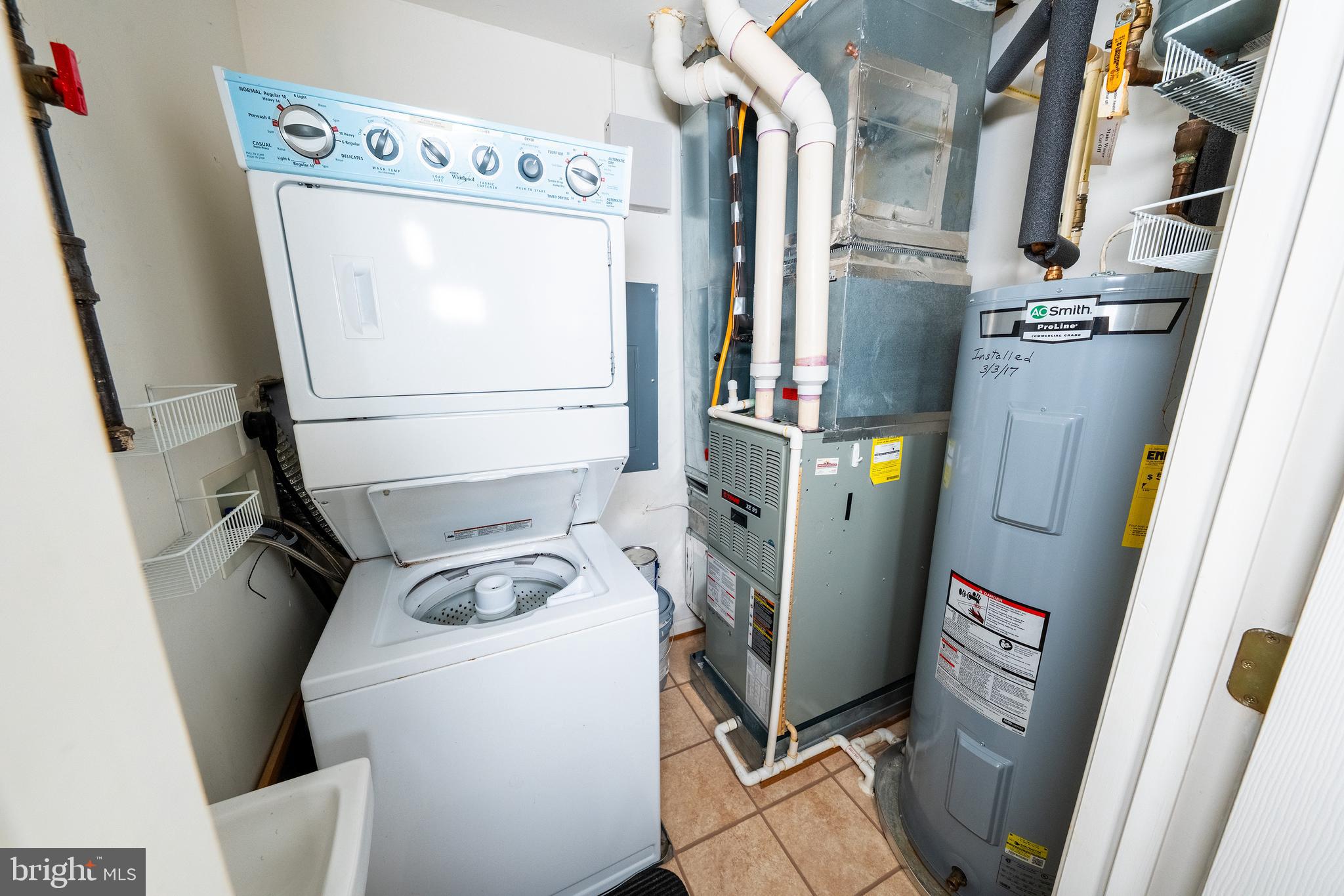6506 Ridenour Way East, Unit 3A Eldersburg, MD 21784 - Photo 17 of 24 a utility room with dryer and washer