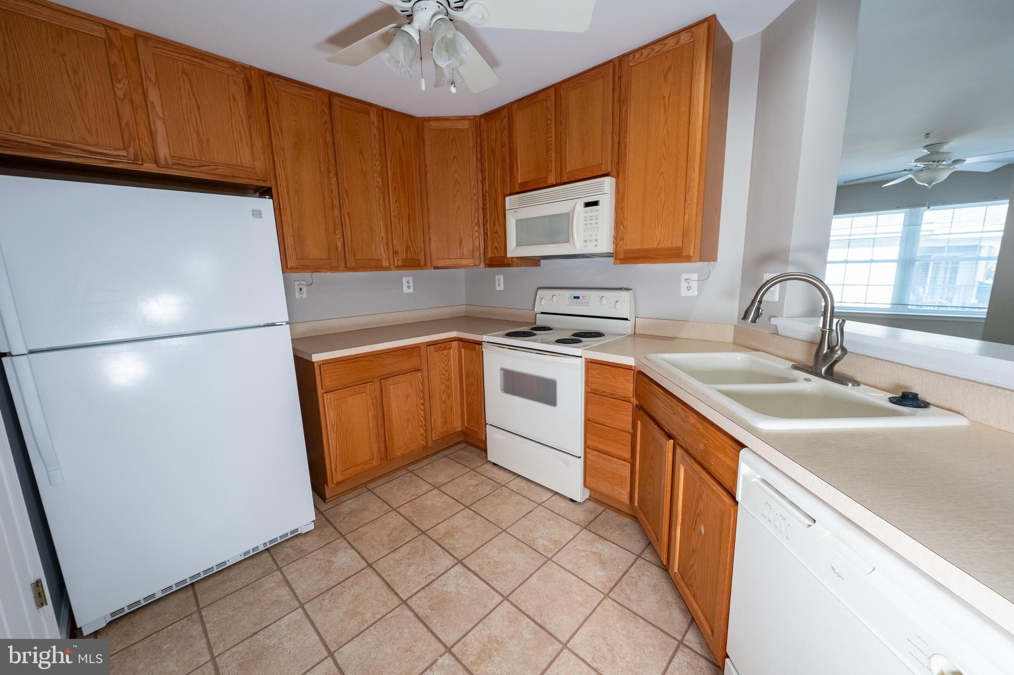 6506 Ridenour Way East, Unit 3A Eldersburg, MD 21784 - Photo 3 of 24 a kitchen with a sink appliances and cabinets