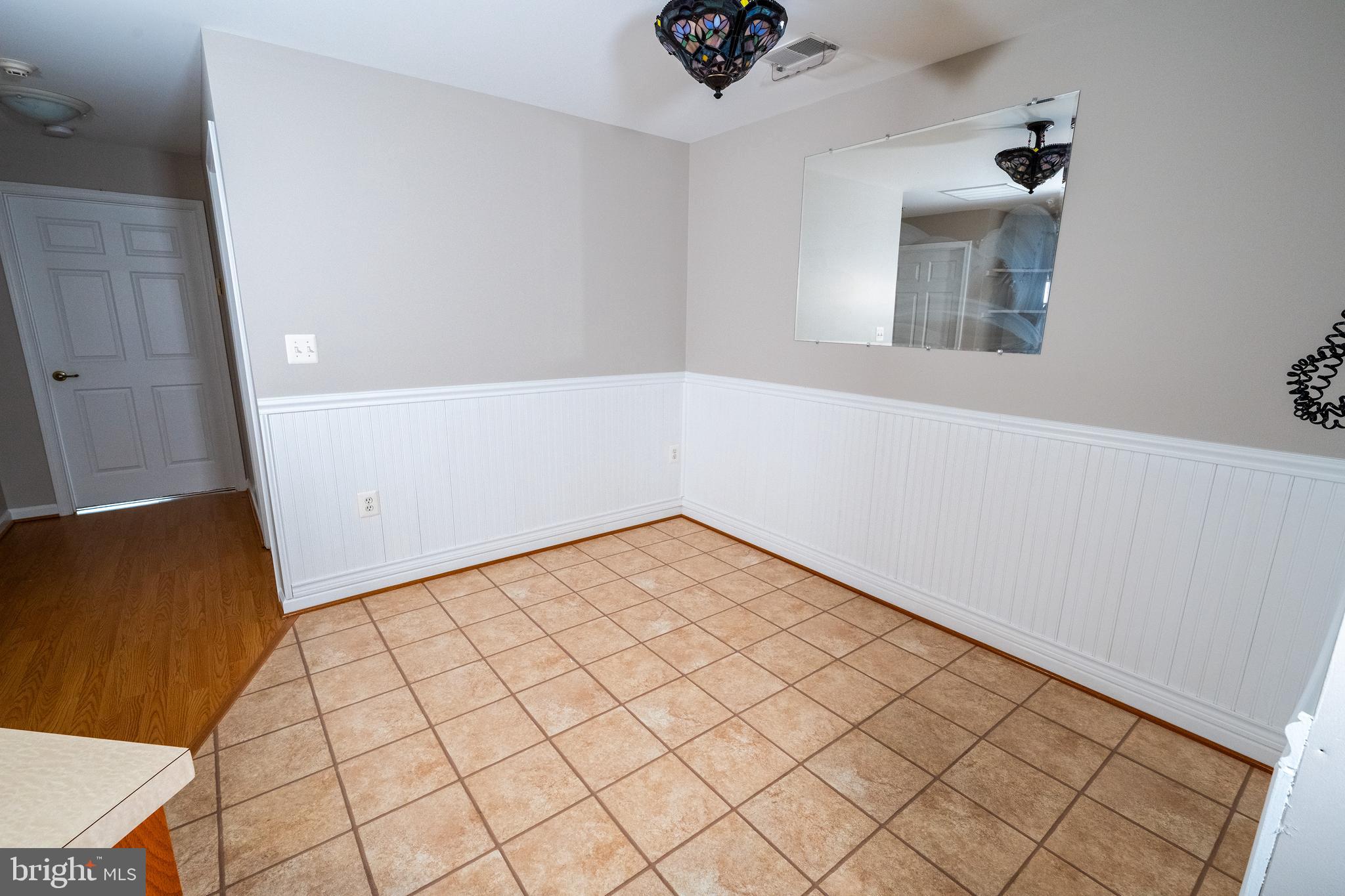 6506 Ridenour Way East, Unit 3A Eldersburg, MD 21784 - Photo 6 of 24 wooden floor in an empty room