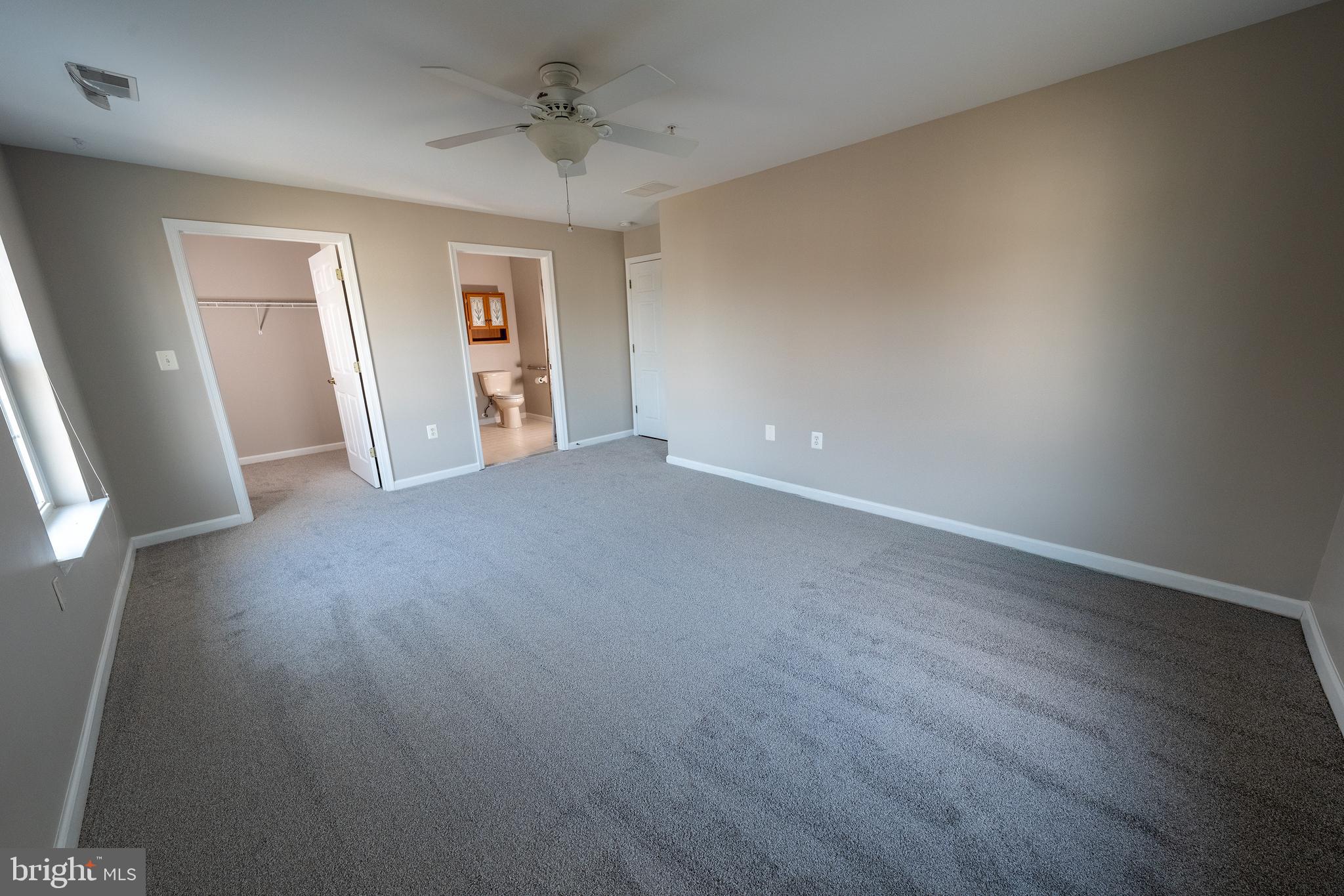 6506 Ridenour Way East, Unit 3A Eldersburg, MD 21784 - Photo 7 of 24 a view of a big room with wooden floor and windows