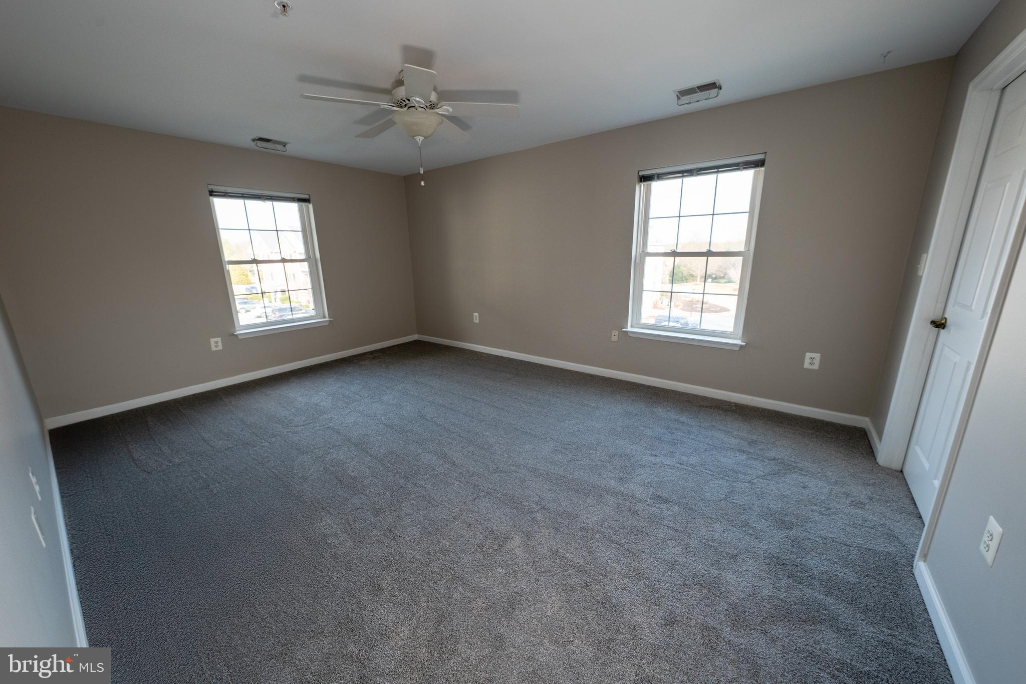 6506 Ridenour Way East, Unit 3A Eldersburg, MD 21784 - Photo 8 of 24 a view of an empty room with a window