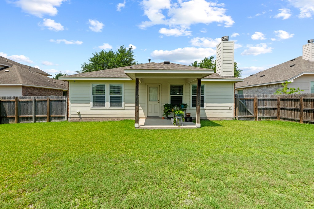 12008 Lansdowne Road Austin, TX 78754 - Photo 28 of 29 A neatly manicured lawn provides ample space for outdoor enjoyment behind this charming residence.
