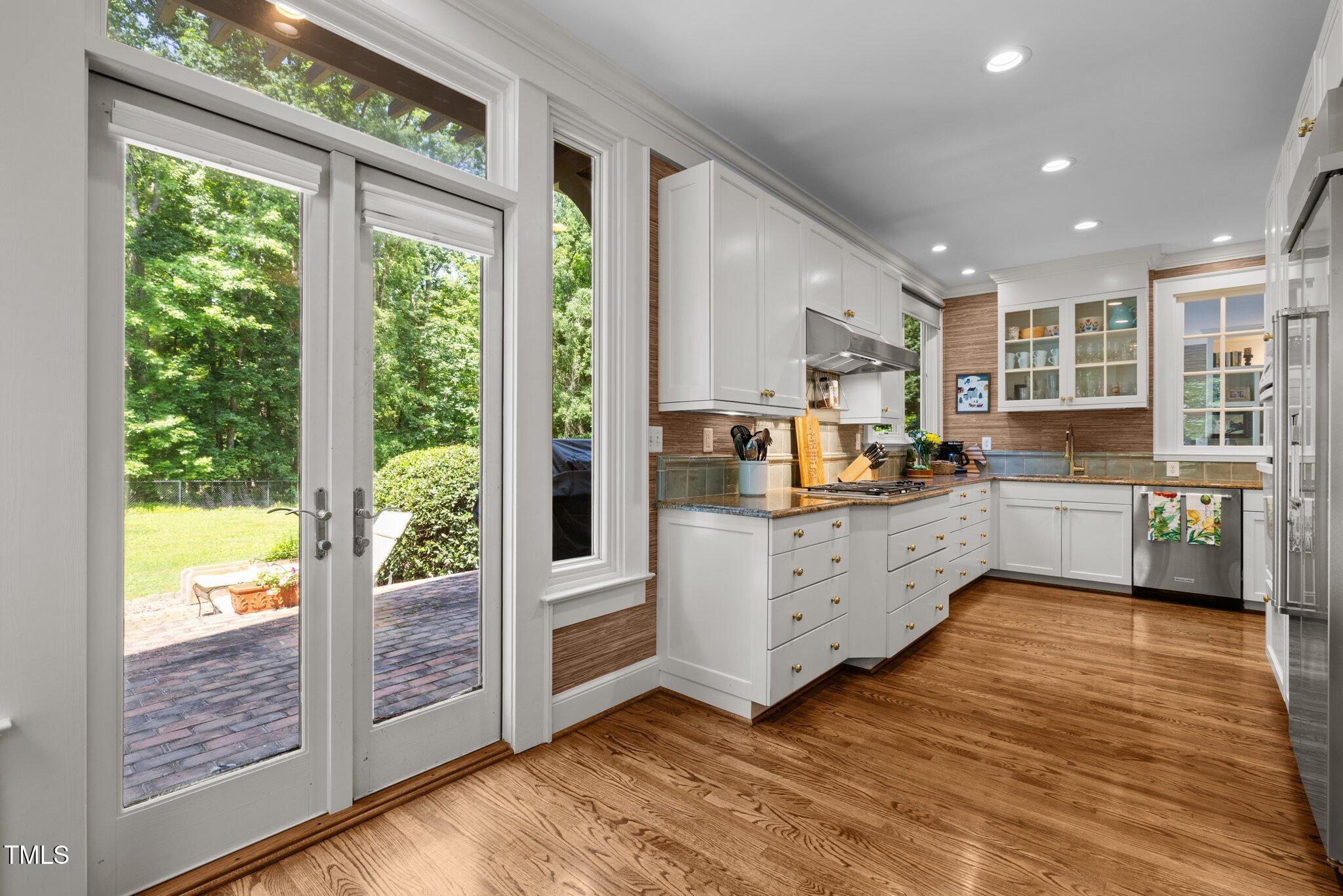 1624 Hopkins Road Bahama, NC 27503 - Photo 26 of 100 a kitchen with window a sink and cabinets