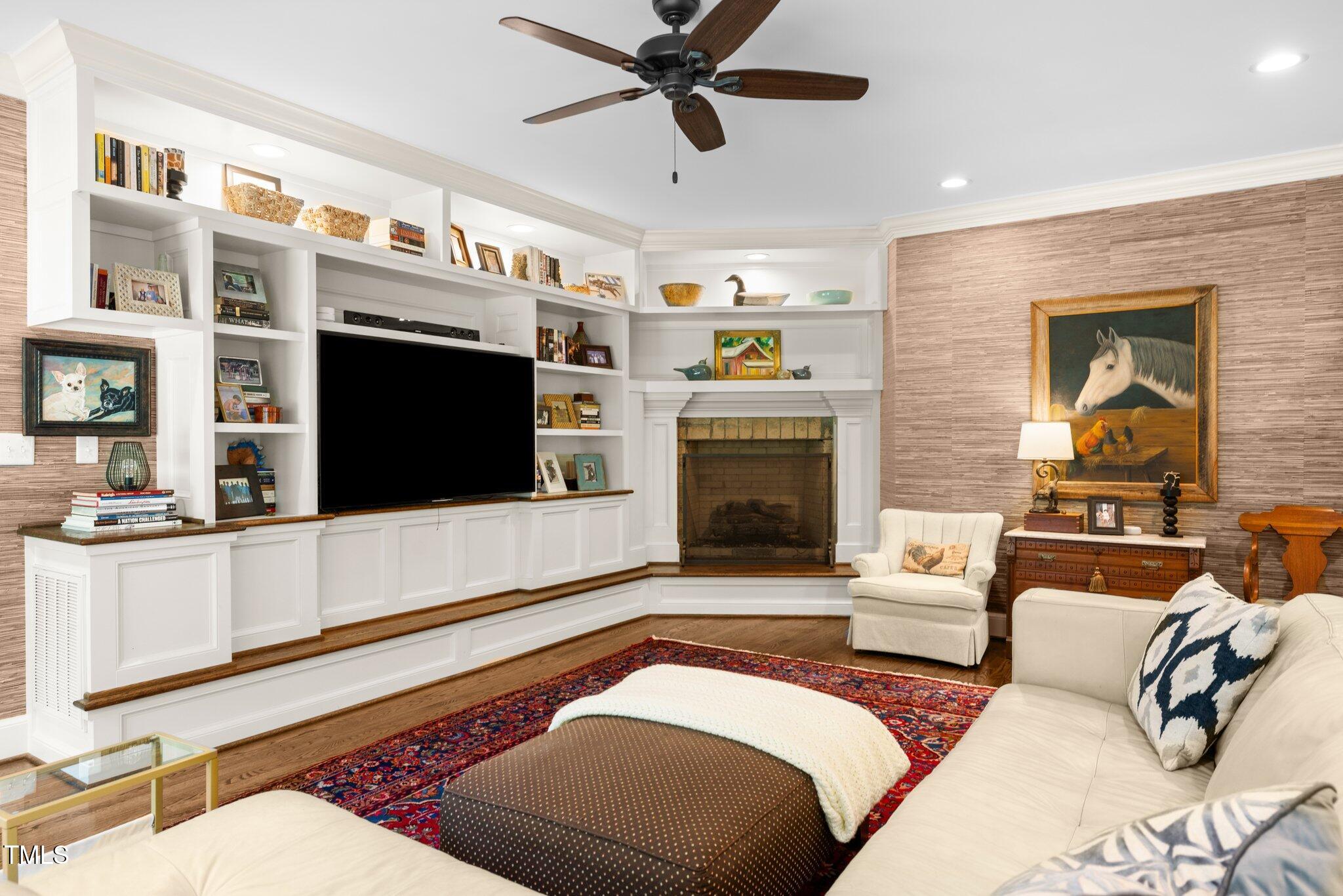 1624 Hopkins Road Bahama, NC 27503 - Photo 28 of 100 a living room with furniture flat screen tv and a fireplace