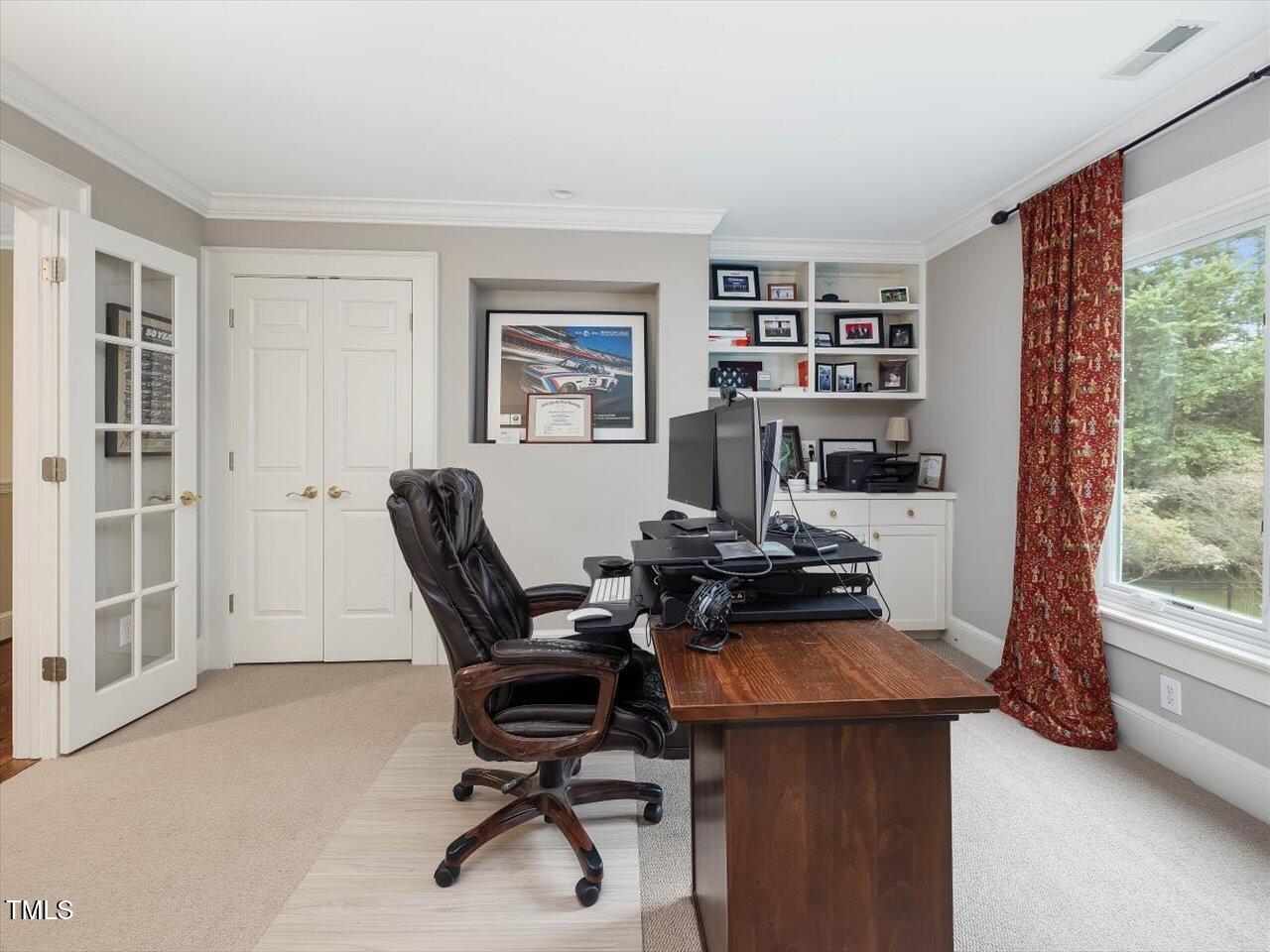 1624 Hopkins Road Bahama, NC 27503 - Photo 44 of 100 a view of a workspace with furniture and a window