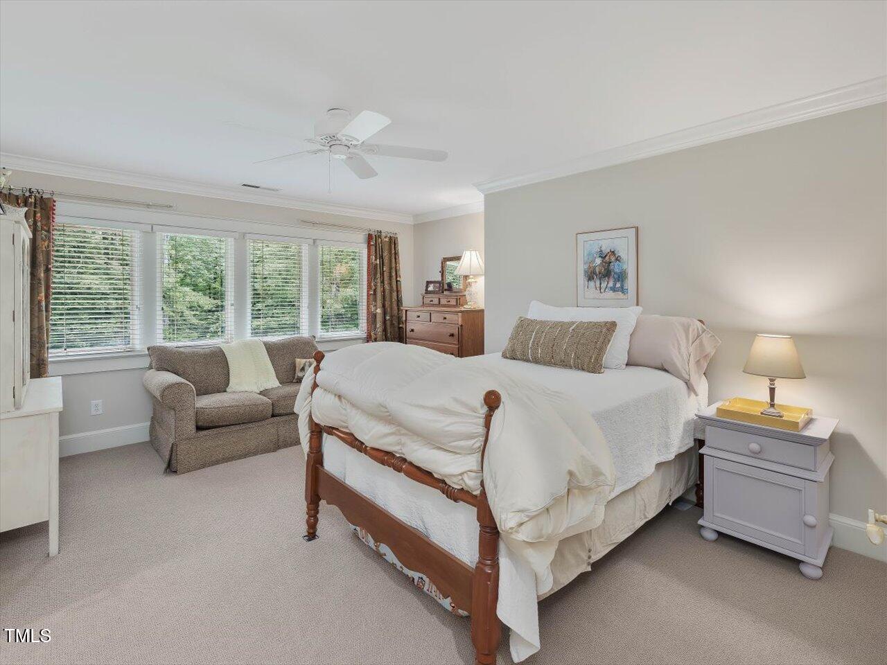1624 Hopkins Road Bahama, NC 27503 - Photo 45 of 100 a bedroom with a bed and a couch with window