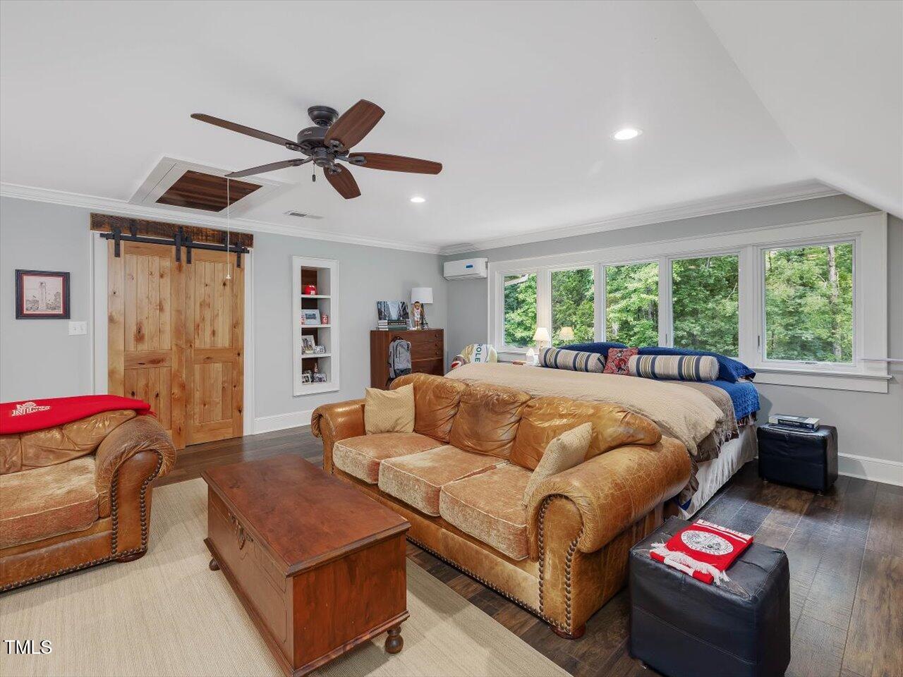 1624 Hopkins Road Bahama, NC 27503 - Photo 48 of 100 a bed room with a bed and a couch