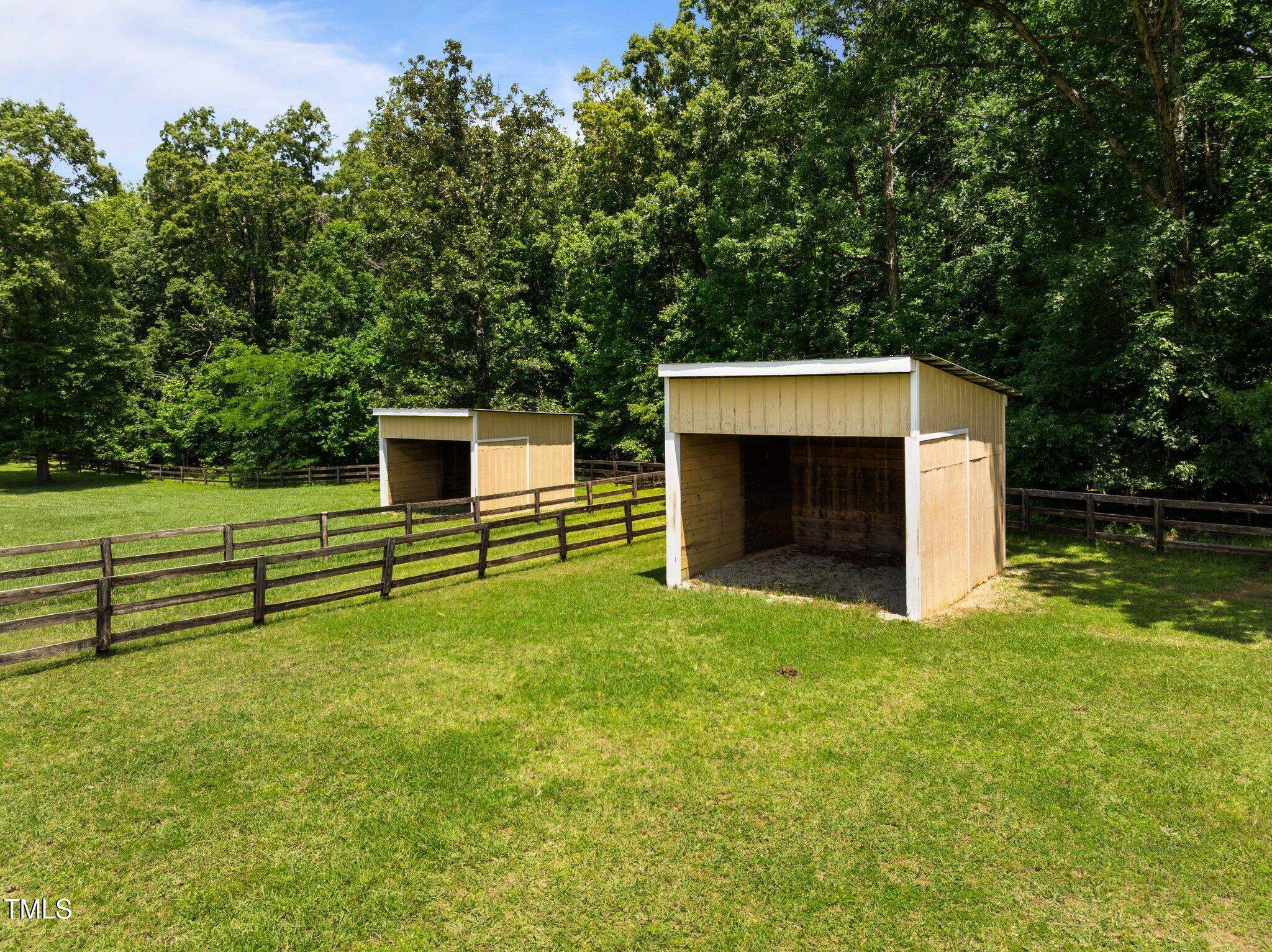 1624 Hopkins Road Bahama, NC 27503 - Photo 76 of 100 a backyard of a house with oven and garage