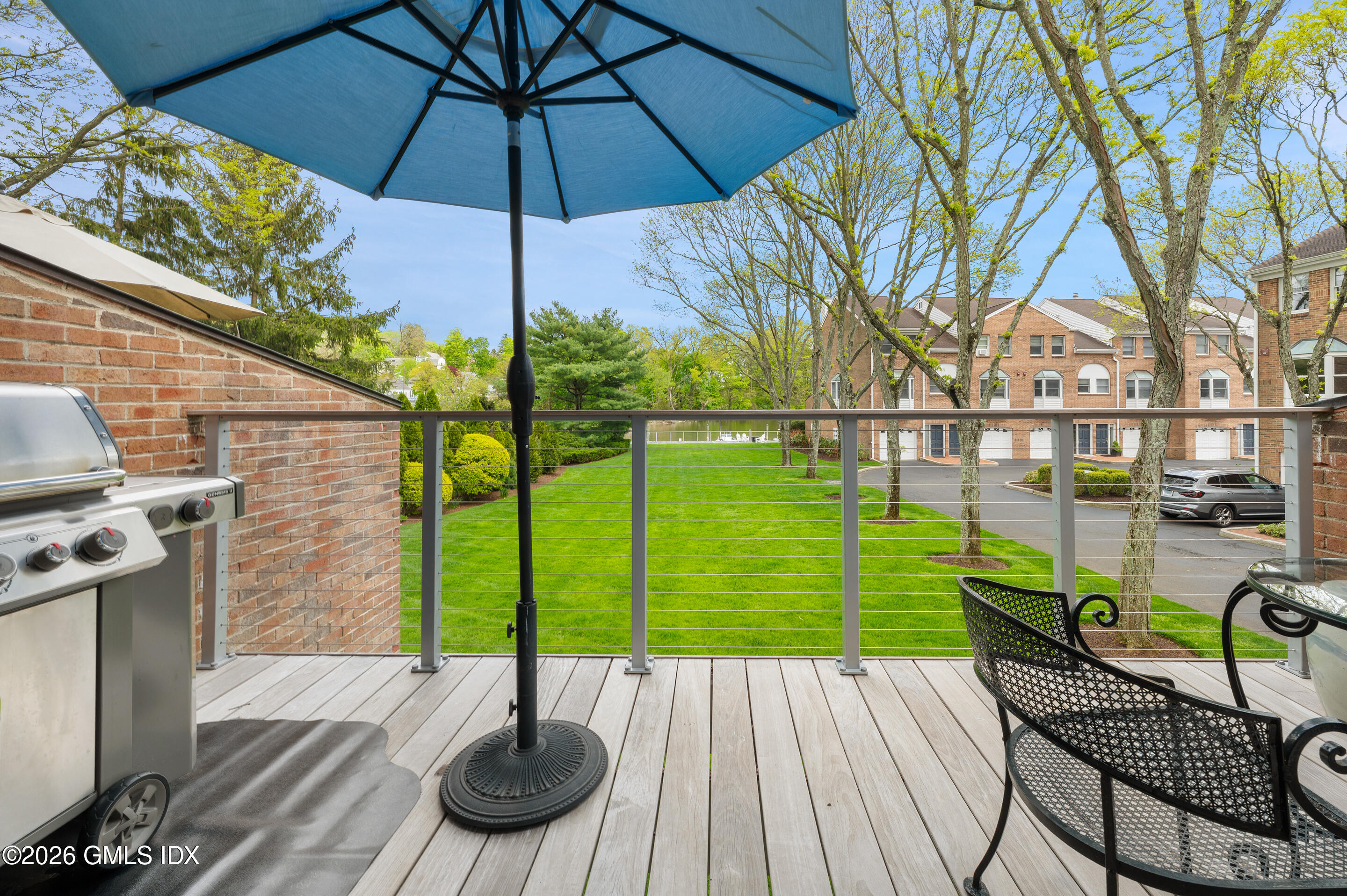 115 River Road, Unit 3 Cos Cob, CT 06807 - Photo 36 of 40 a view of a chairs and table in the patio