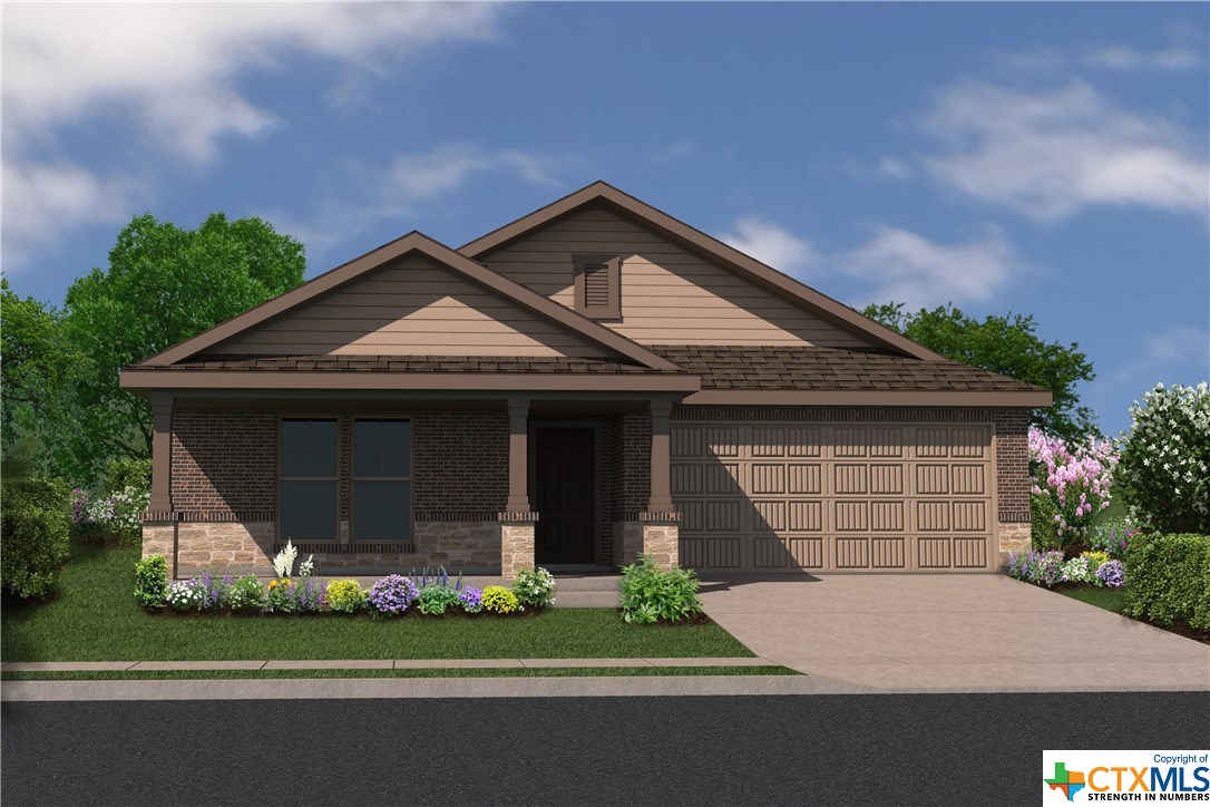 191 Beth Ann Loop Taylor, TX 76574 - Photo 1 of 1 a front view of a house with a garden and plants