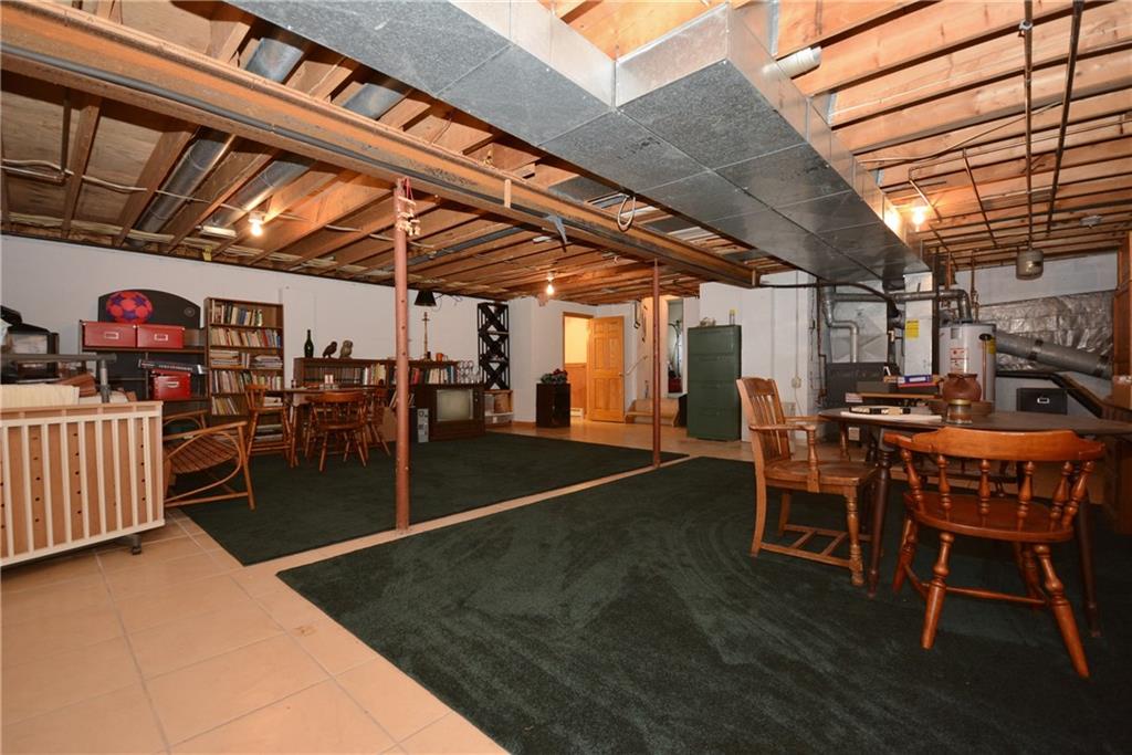 136 Buss Road Aliquippa, PA 15001 - Photo 18 of 25 Huge Bonus room with ceramic tile flooring off the garage. Perfect for entertaining or a playroom for your children with ample space for toys and storage.