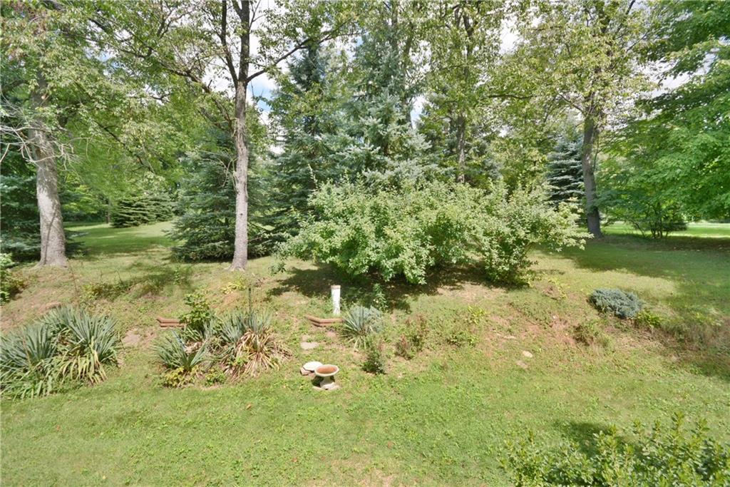 136 Buss Road Aliquippa, PA 15001 - Photo 24 of 25 Backyard with mature trees and landscapping