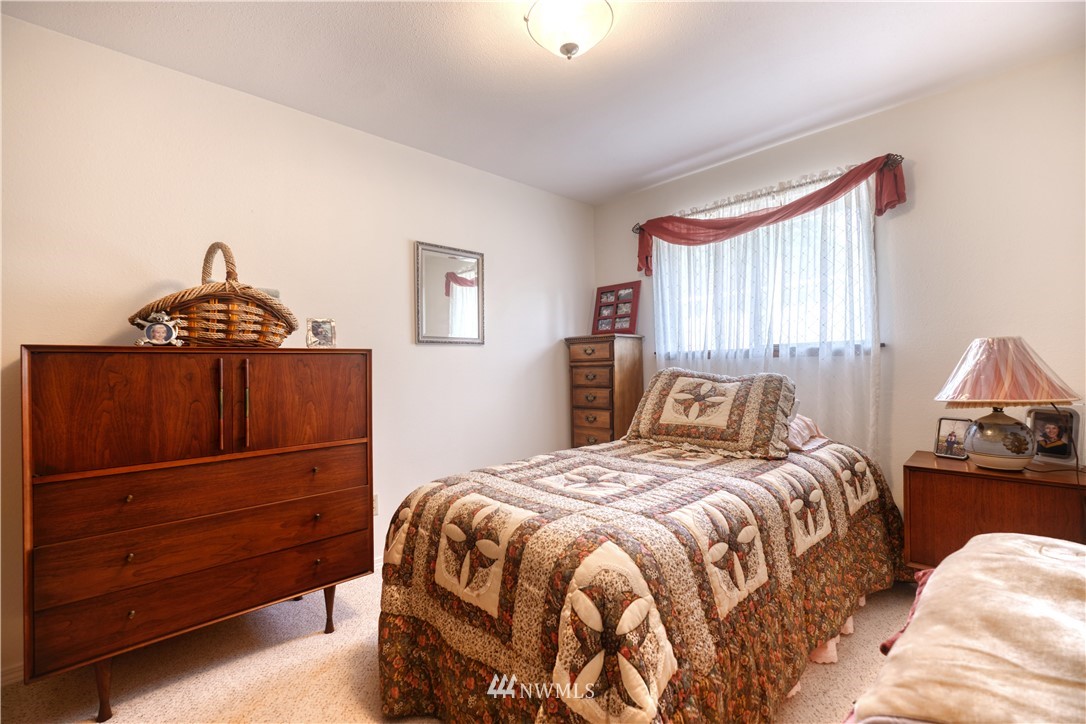542 Boundary Bay Road Point Roberts, WA 98281 - Photo 11 of 23 a bedroom with a bed and a window