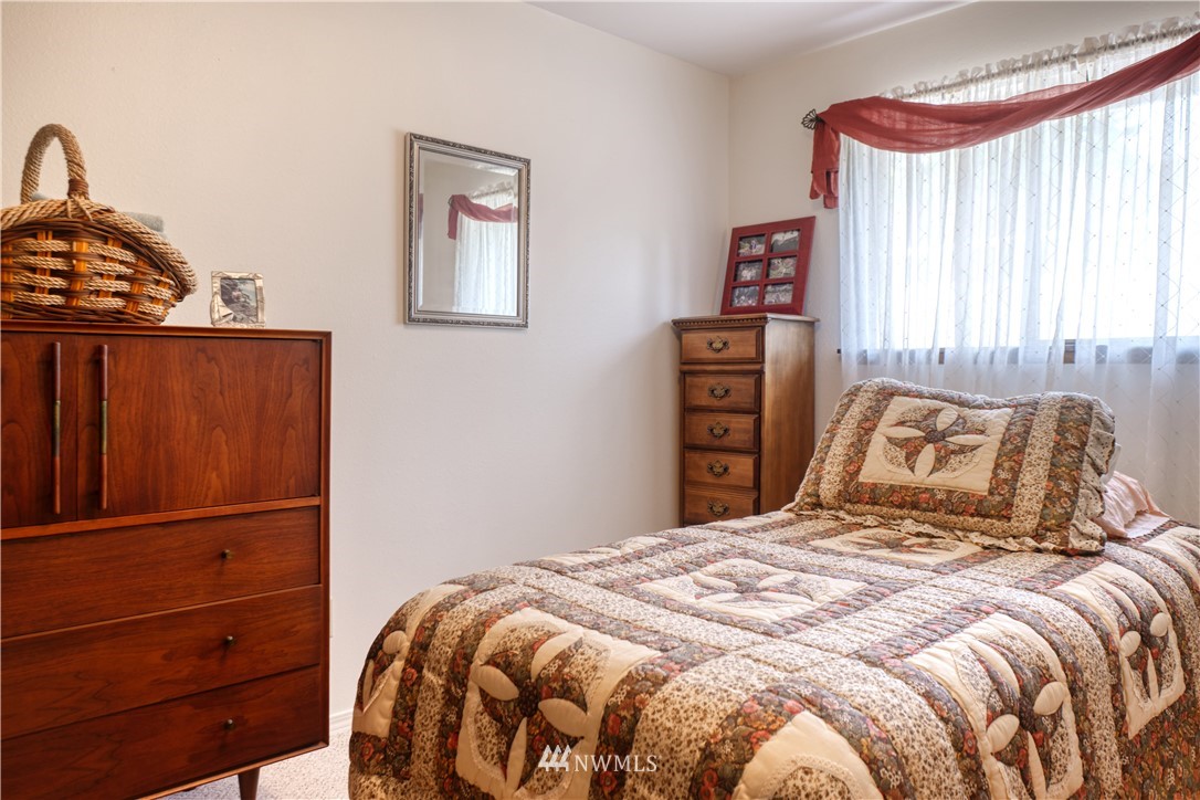 542 Boundary Bay Road Point Roberts, WA 98281 - Photo 12 of 23 a bedroom with a bed and a dresser