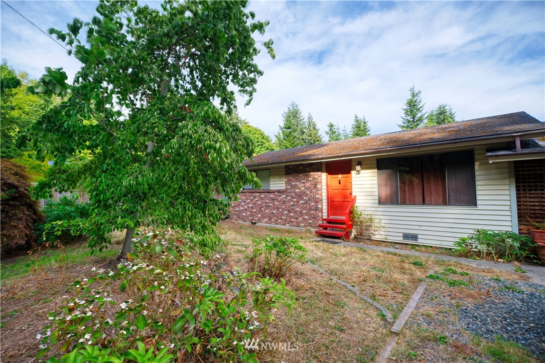 542 Boundary Bay Road Point Roberts, WA 98281 - Photo 3 of 23 a front view of a house with a yard