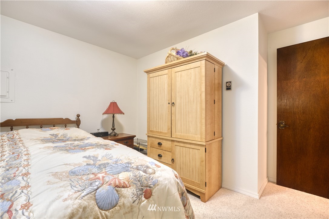 542 Boundary Bay Road Point Roberts, WA 98281 - Photo 10 of 23 a bedroom with a bed and a cabinets