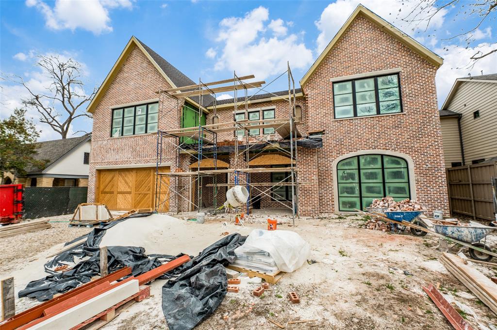 a view of house with yard outdoor seating and barbeque oven