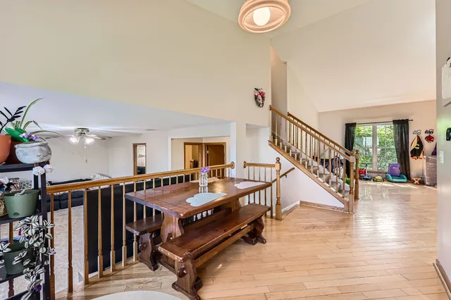 a very nice looking room with wooden floor and stairs