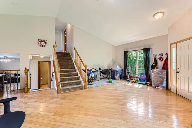 a view of a livingroom with furniture and a workspace
