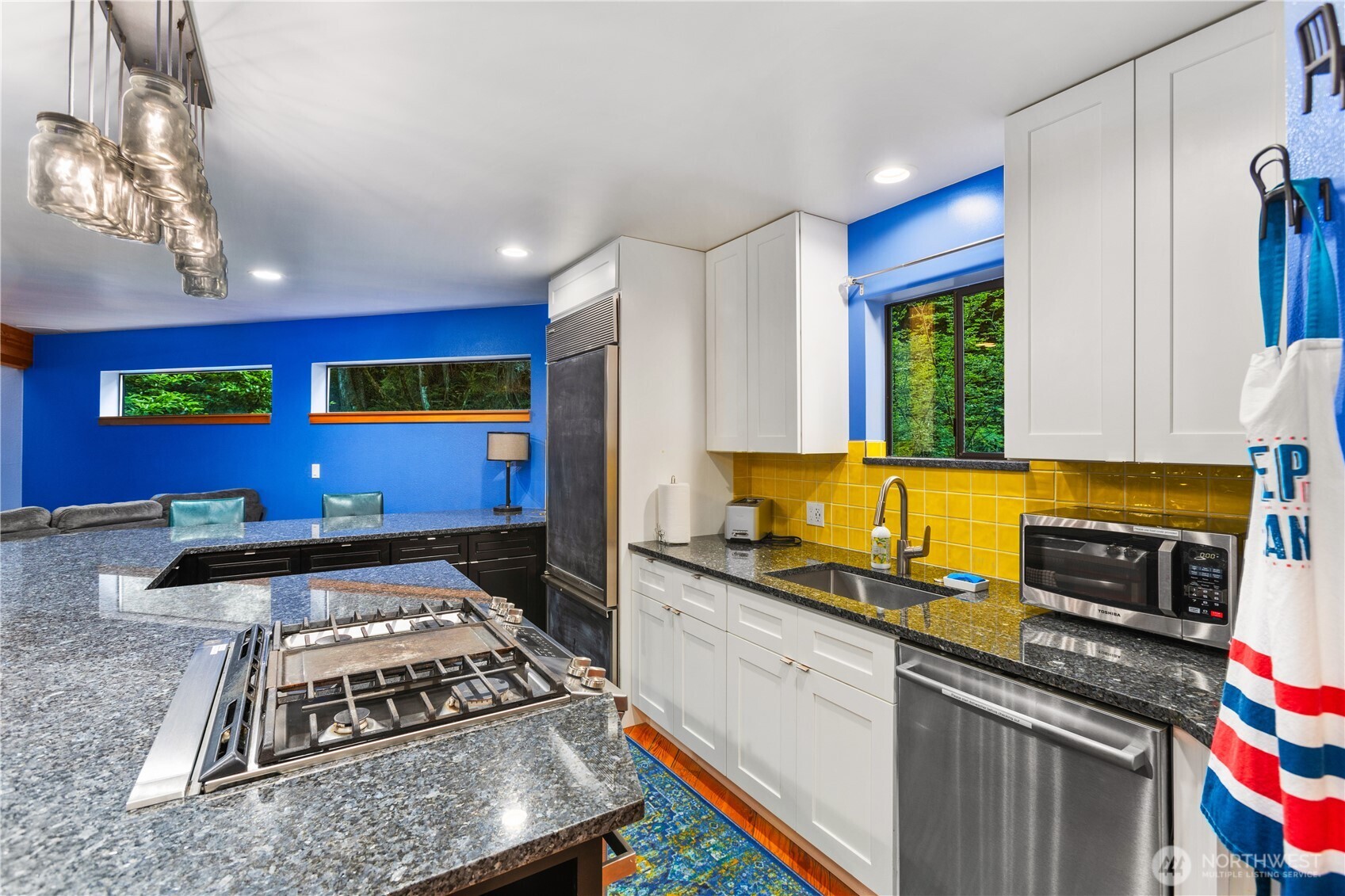 6520 East Mercer Way Mercer Island, WA 98040 - Photo 21 of 36 a kitchen with stainless steel appliances granite countertop a stove a sink and a microwave