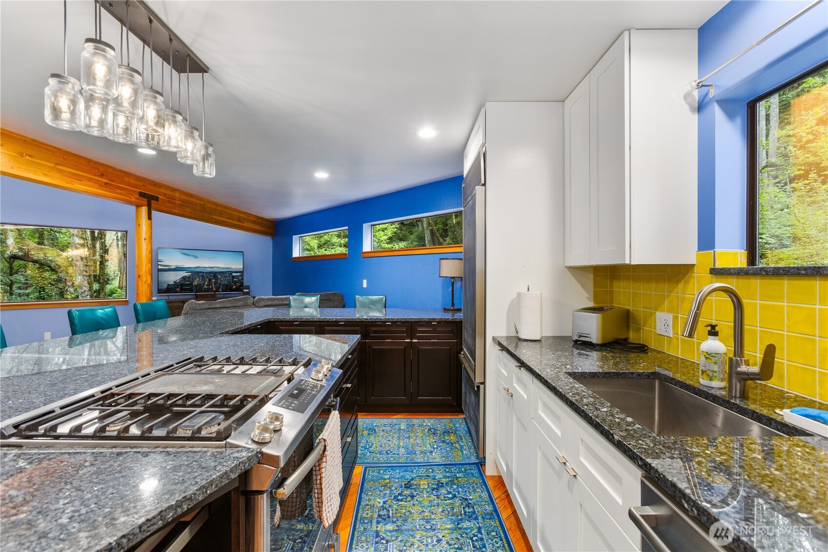 6520 East Mercer Way Mercer Island, WA 98040 - Photo 23 of 36 a kitchen with stainless steel appliances granite countertop a stove a sink and a microwave