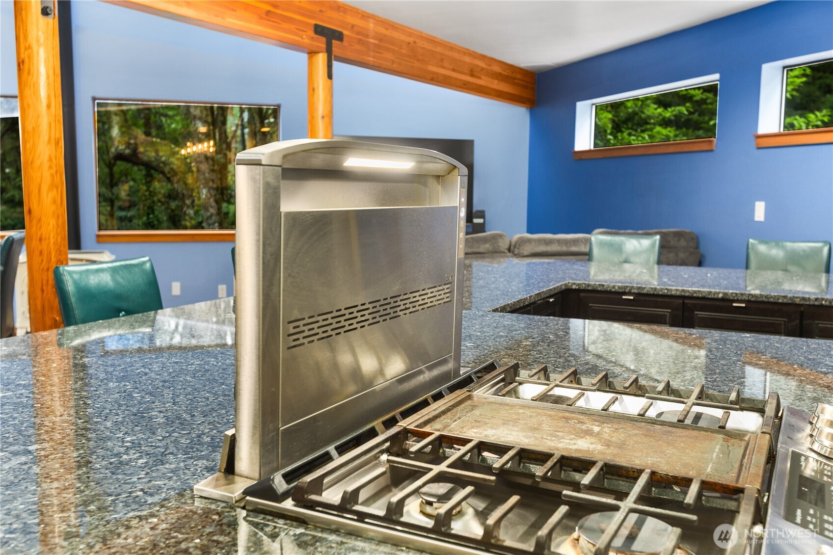6520 East Mercer Way Mercer Island, WA 98040 - Photo 24 of 36 a living room with a fireplace and a table